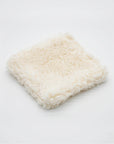 Plush and generously sized square pad made from 100% organic, dye-free sherpa cotton. Handmade and gentle for full-face cleansing.